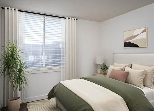 a bedroom with a bed and a window and a plant