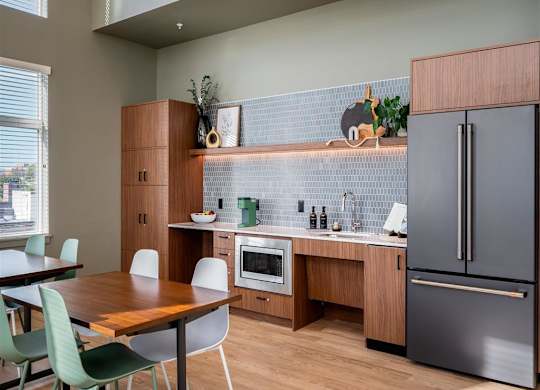 a kitchen and dining area with a table and chairs