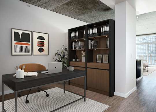 a home office with a desk and a laptop