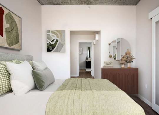 a bedroom with a bed and a dresser and a bathroom
