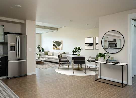 a living room with a kitchen and a dining room