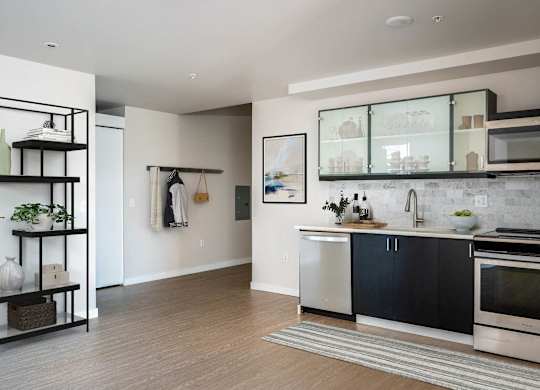 a kitchen with a sink and a stove and a window