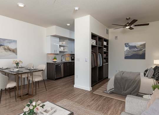 A modern living room with a dining table and chairs.