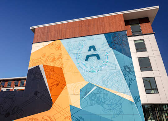 A building with a large mural on its side.