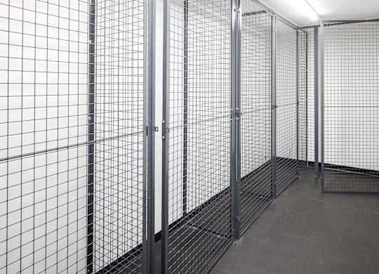 A room with a metal grid partitioning the space.