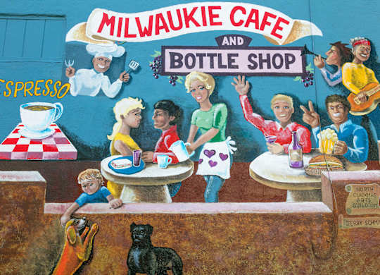 A mural of a Milwaukie Cafe and Bottle Shop with various people and a dog.