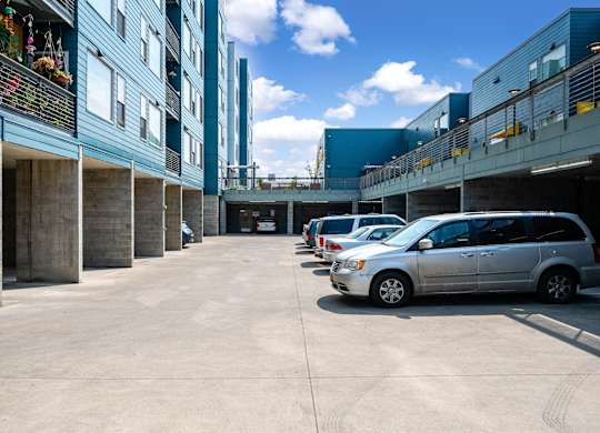 a row of parked cars in front of a building