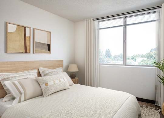 a bedroom with a bed and a large window