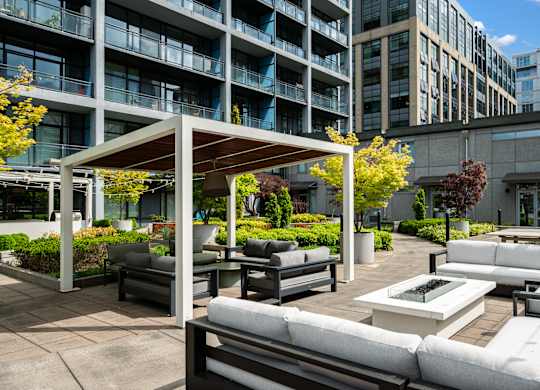 A patio area with white furniture and a canopy.