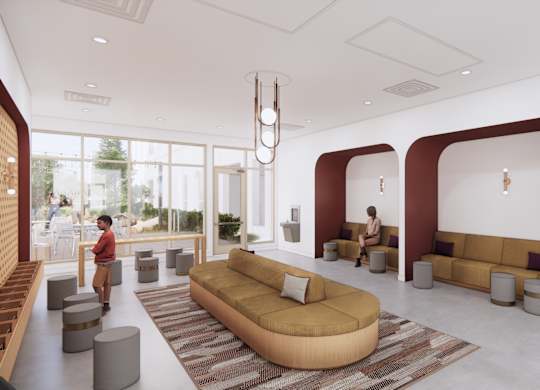 A modern living room with a person sitting on a couch.