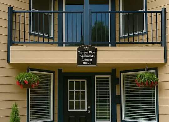 A two-story building with a balcony and a sign that says "Temporary View" and "Apartments".