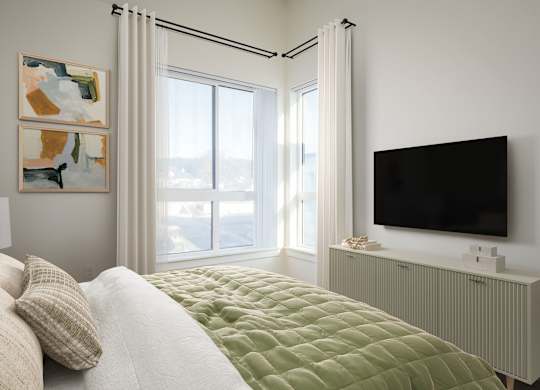 A bedroom with a bed, a television, and two paintings on the wall.