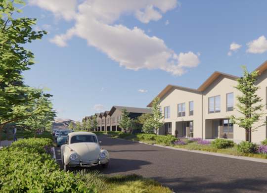 A street view of a residential area with houses and a car parked on the side.