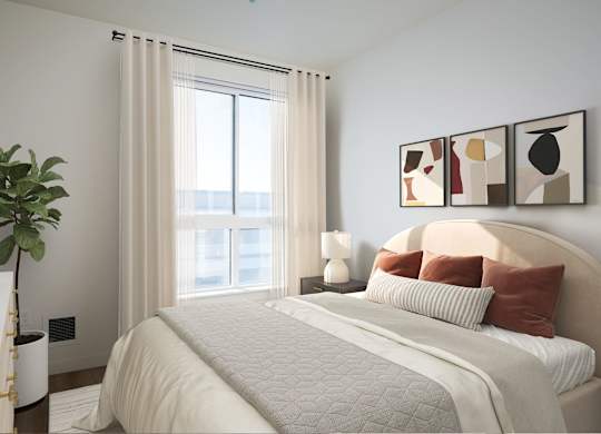 A bedroom with a large bed, a potted plant, and a window with curtains.