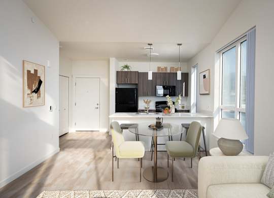 A modern living room with a kitchen in the background.