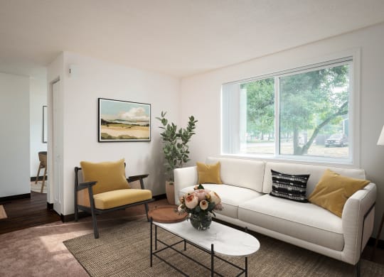 a living room with a white couch and a coffee table
