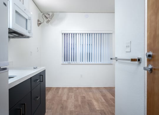 a kitchen and dining area in a 555 waverly unit