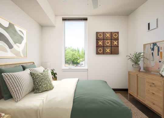 a bedroom with a large bed and a window