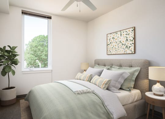 a bedroom with a bed and a ceiling fan