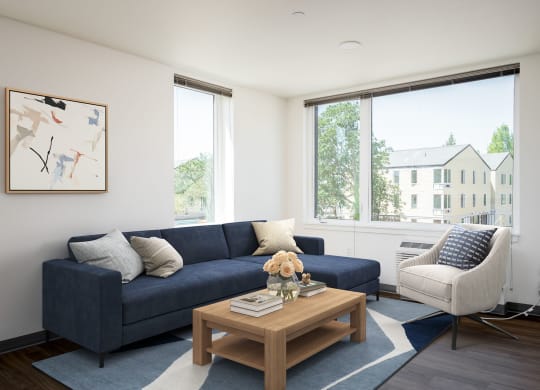 a living room with a blue couch and a coffee table