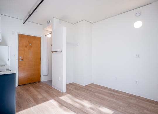 a kitchen and living room in a small apartment