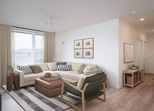 a living room with white walls and wooden floors