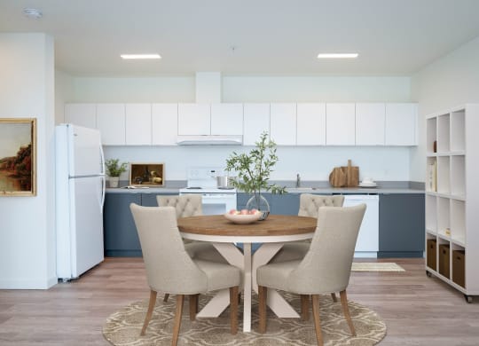 a kitchen and dining area in a 555 waverly unit