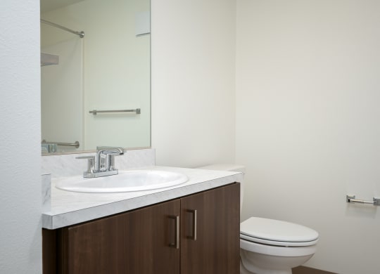 an empty bathroom with a toilet and a sink