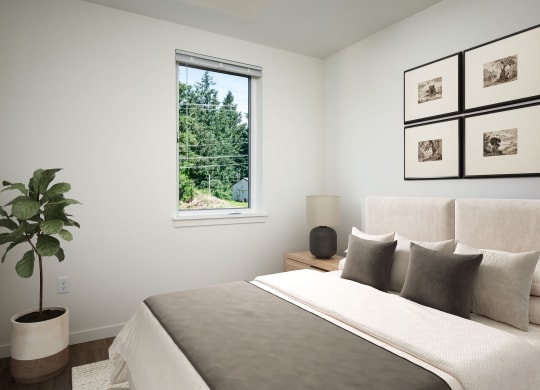 a bedroom with a large bed and a window