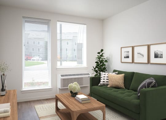 a living room with a green couch and a coffee table