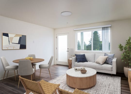 a living room with a couch and a table and a window
