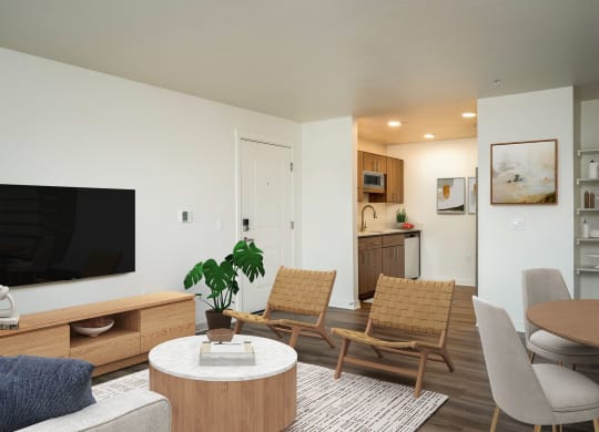 a living room with a table and chairs and a television