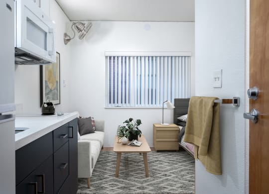 a small living room with a couch and a table