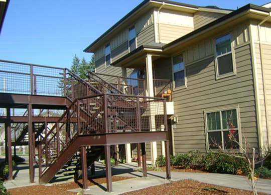 the back of the house has a ramp to the deck