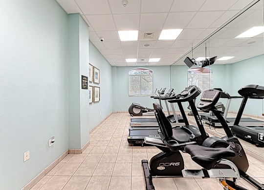 A gym with treadmills and exercise equipment.