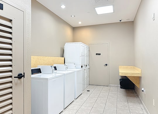 a laundry center with washers and dryers