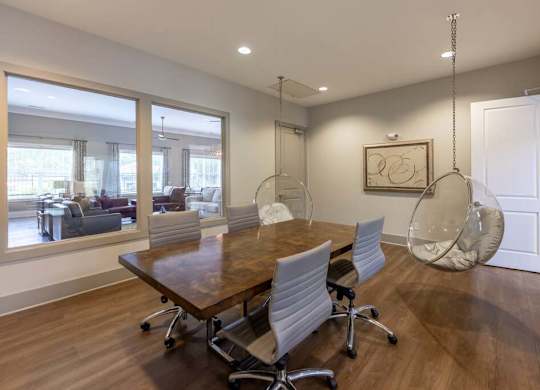 A conference room with a long table and chairs at Foxwood Apartments, North Carolina, 27616