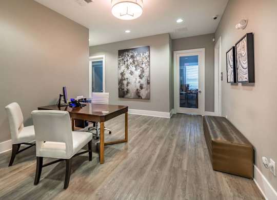 A dining room with a wooden table and chairs at Foxwood Apartments, Raleigh-Durham