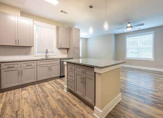 A kitchen with wooden floors and a countertop at Foxwood Apartments, North Carolina, 27616
