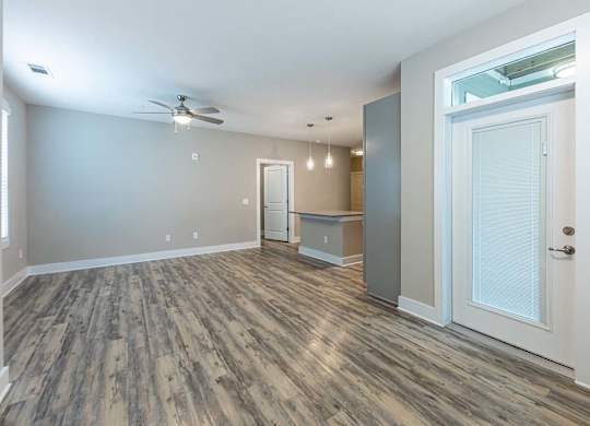 A room with a ceiling fan and wood flooring at Foxwood Apartments, Raleigh-Durham, NC, 27616