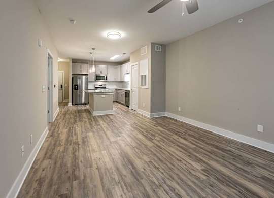 A kitchen area with a refrigerator, microwave, and oven at Foxwood Apartments, Raleigh-Durham, North Carolina