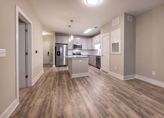 A kitchen with a refrigerator, microwave, and oven at Foxwood Apartments, North Carolina