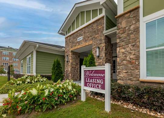 A sign in front of a building that says at Foxwood Apartments, North Carolina
