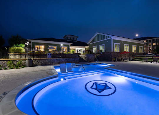 A swimming pool with a diamond logo in the middle of it. at Foxwood Apartments, Raleigh-Durham, 27616