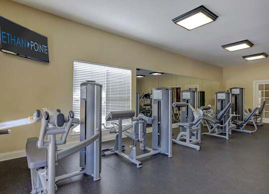 A gym with a sign that says Ethan Pointe at Ethan Pointe Apartments, North Carolina