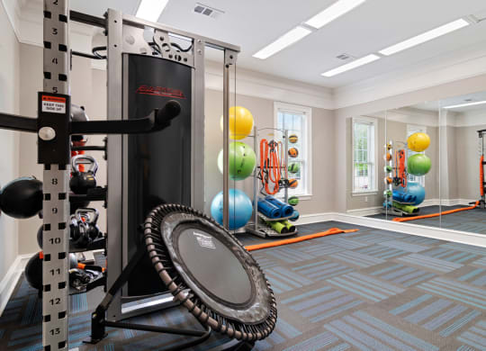 Fitness center with strength and conditioning equipment and large windows for natural lighting