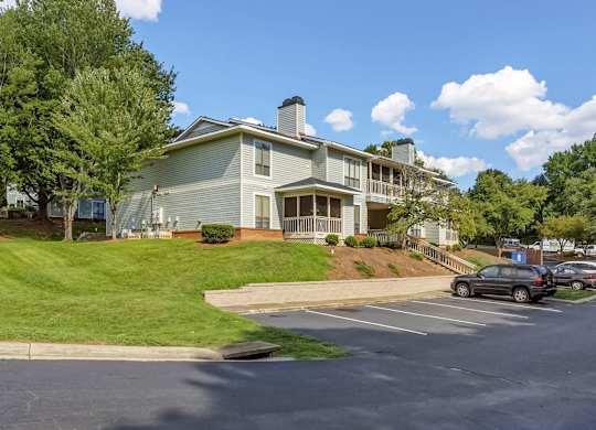 A large building with a parking lot in front of it. at Brandemere Apartment Homes, Winston Salem, 27106