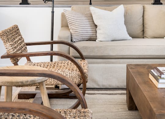 a living room with a sofa and chair at Bridges at Mallard Creek Apartment Homes, Charlotte, NC