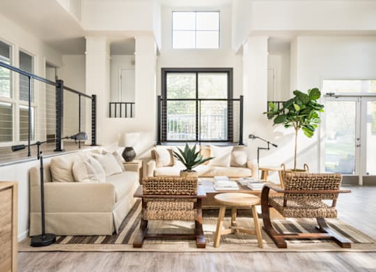 a living room filled with furniture and a large window at Bridges at Mallard Creek Apartment Homes, Charlotte, 28269