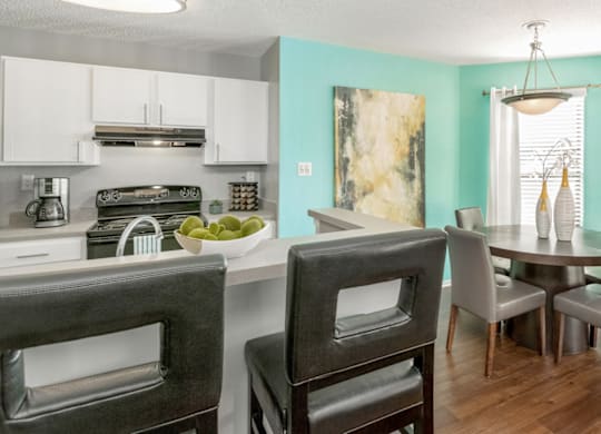 Kitchen And Dining Area at Bridges at Mallard Creek Apartment Homes, North Carolina